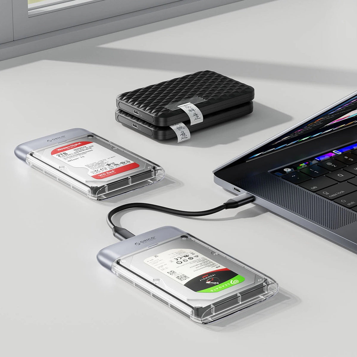 Kieszeń dyskowa Orico TX25C3 2,5" HDD/SSD USB-C 5Gb/s - przezroczysta – zdjęcie 3